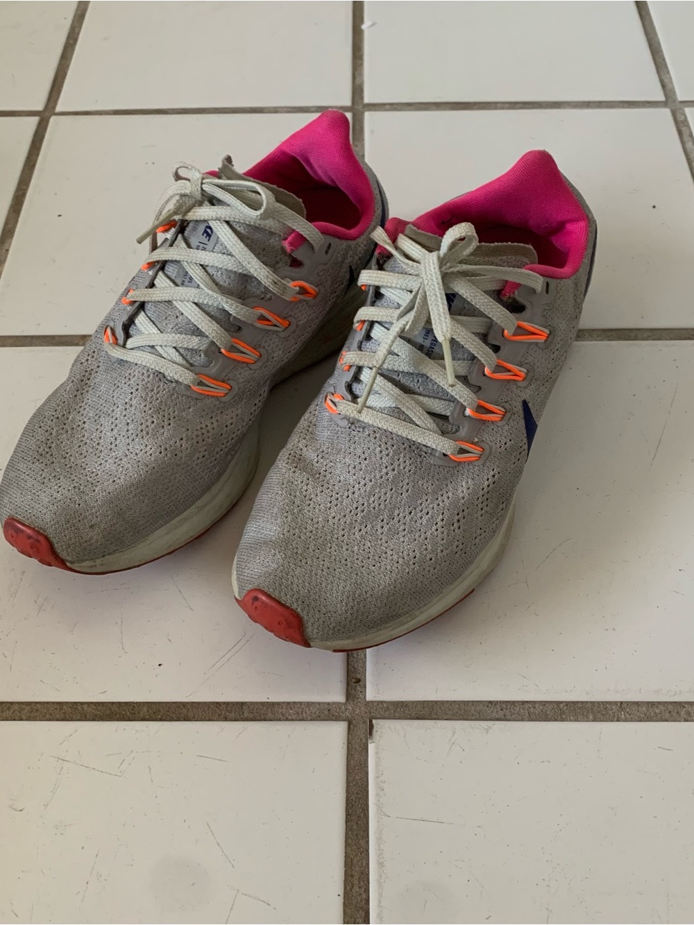Nike Women’s Gray Running Sneakers with Pink Lining and Orange Accents